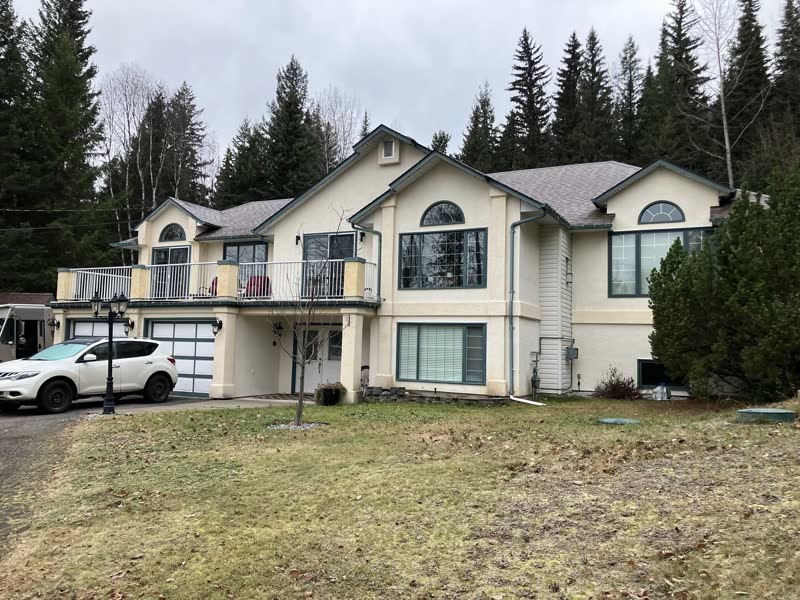 Two-storey home with new arched and casement windows