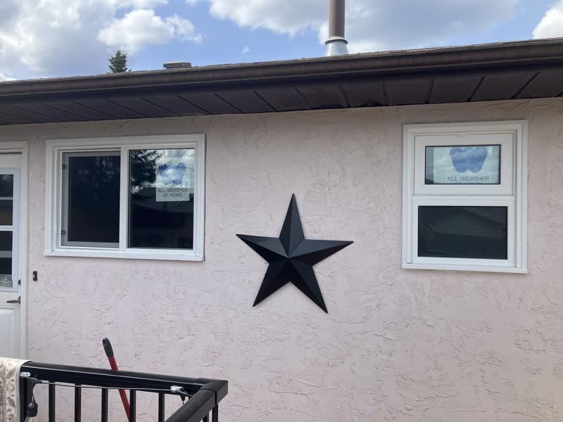After the glow-up: same wall, crisp new windows — the star stays