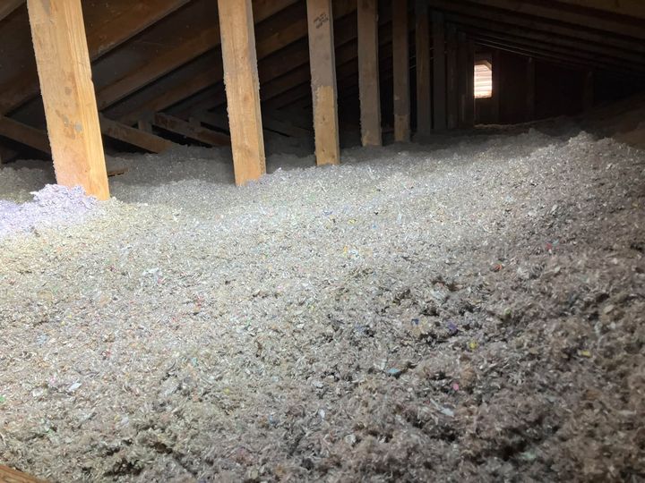 Attic blanketed in fresh blown-in cellulose at R50