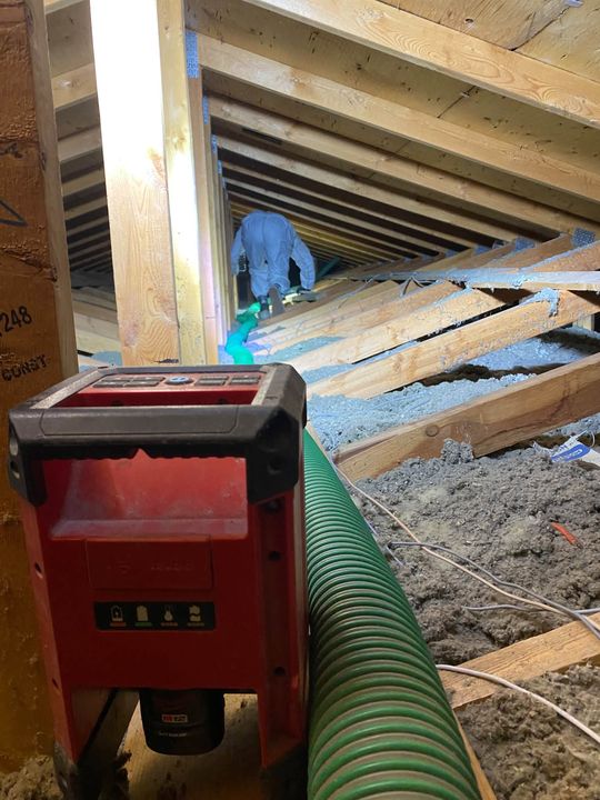 Blower hose and remote in the attic during the top-up