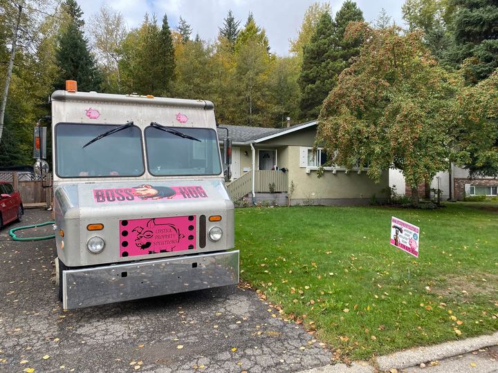 Lipstick insulation truck parked in front of the home