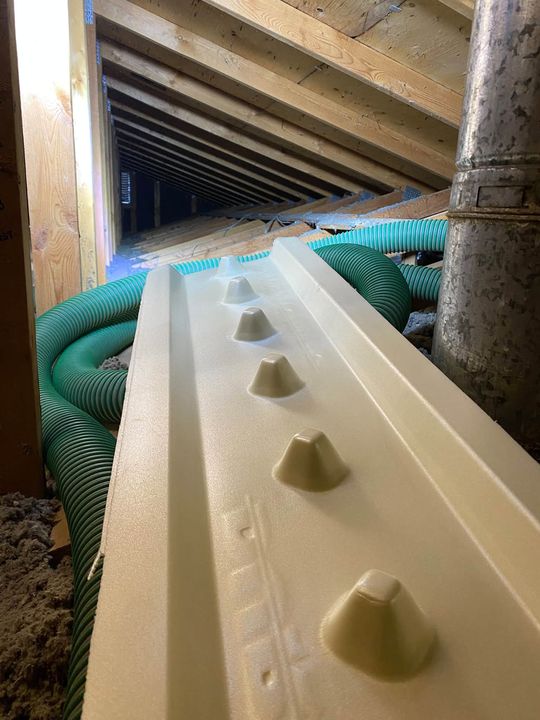 New ventilation chute installed between the roof trusses