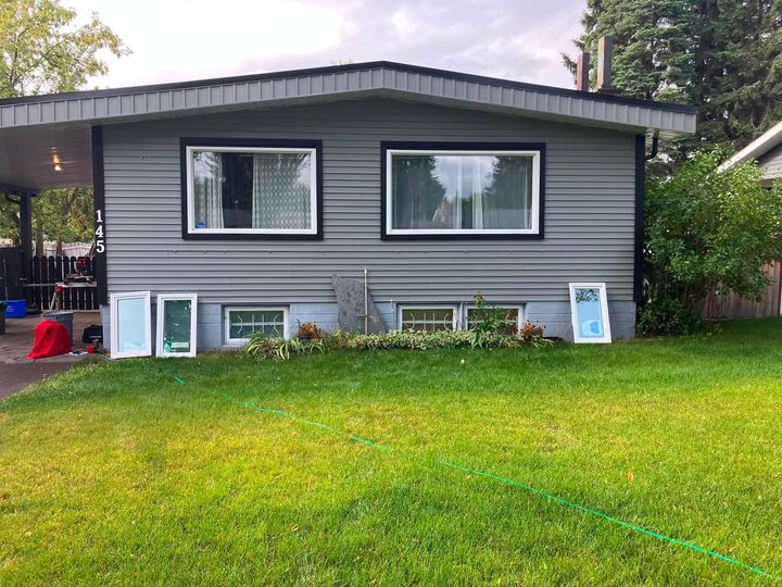 Old basement windows out and the new ones set on the lawn