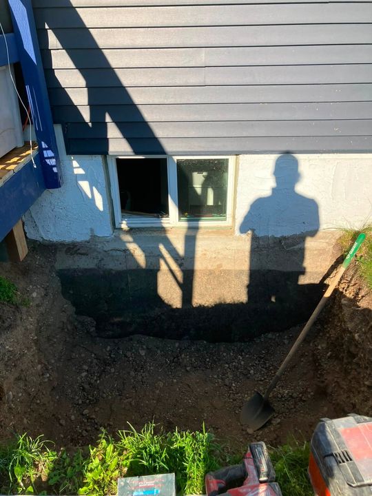 Before: Excavated pit below the old basement window