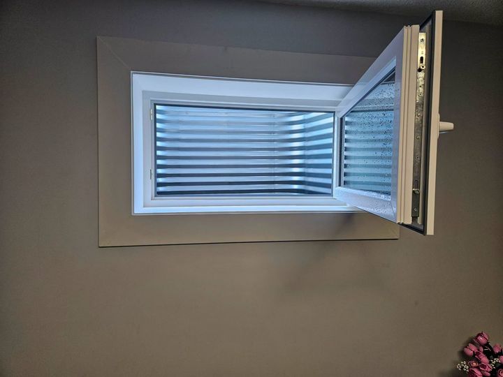 Egress window opened fully from inside the basement