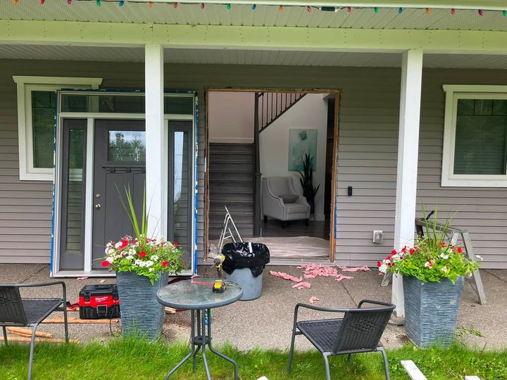 Covered porch with the entry door opening exposed during the reinstall