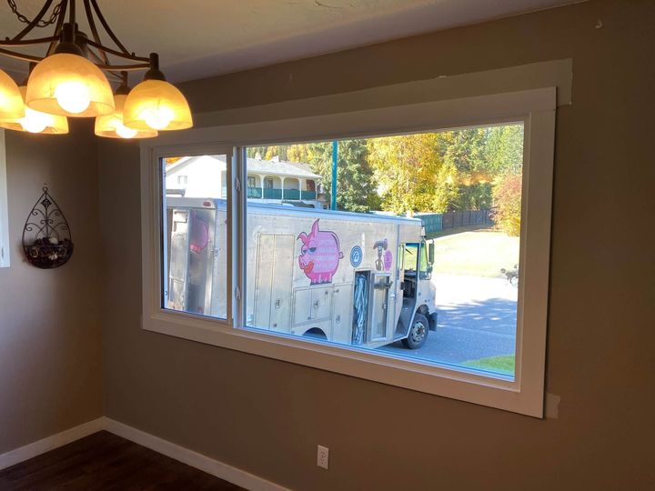 Finished triple-pane picture window in the dining room with new trim