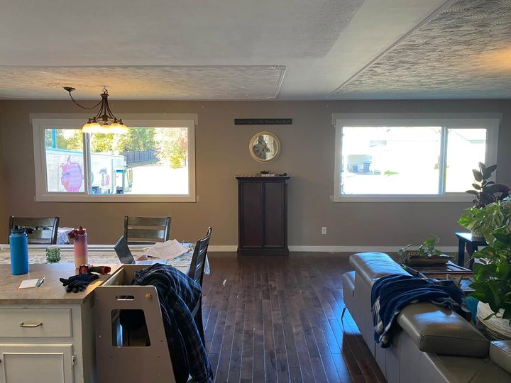 Open-plan living room and kitchen with the reconfigured front windows