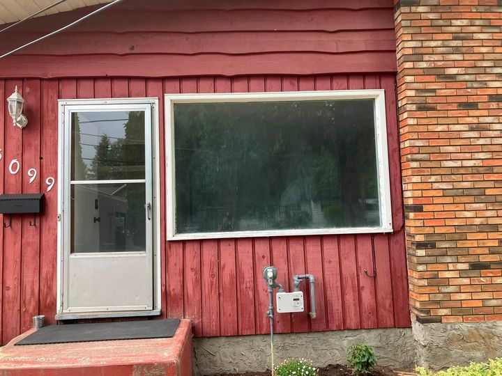 Red-sided house with the old living room window
