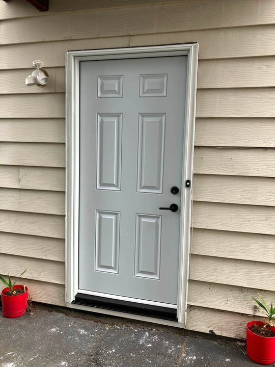 New six-panel steel entry door installed